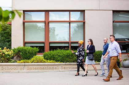 Students walking in front of AU's School of International Service building