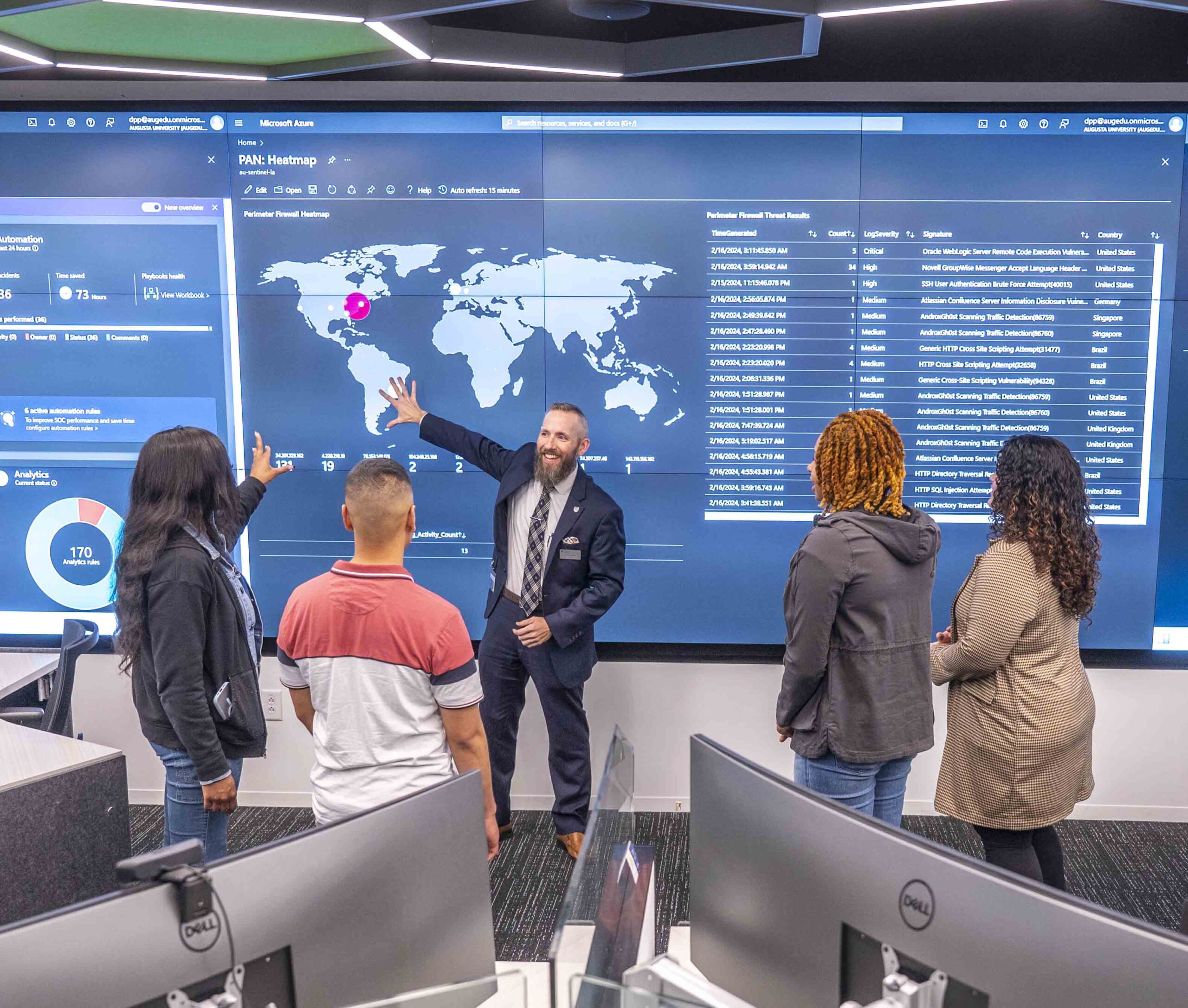 Dr. Craig Albert, middle, leads a group of students on tour of Augusta University’s Security Operations Center at the Georgia Cyber Center in Augusta, GA