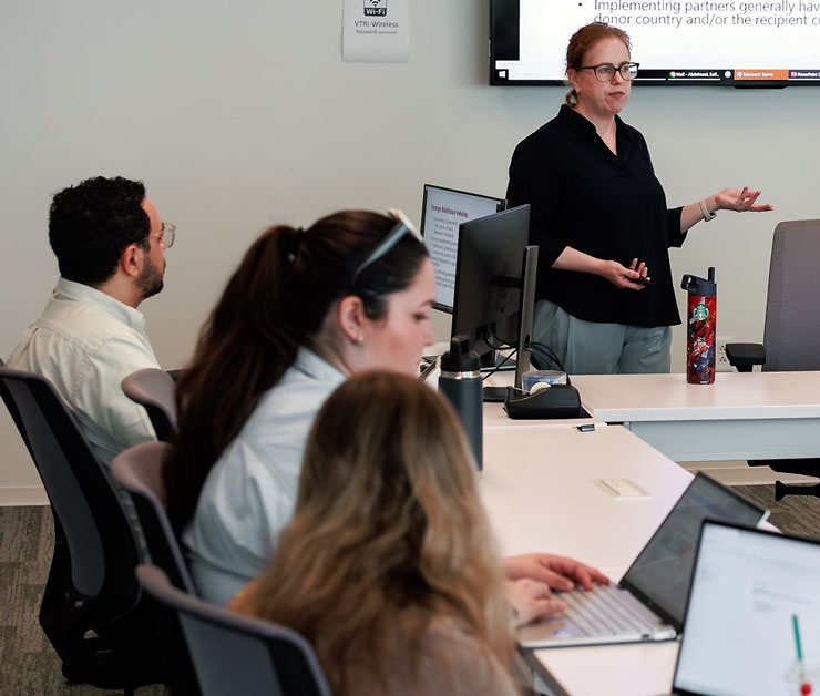 Professor talking to students in a classroom